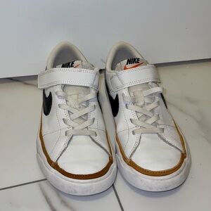 Nike Kids White Sneakers with Black Swoosh and Brown Accent